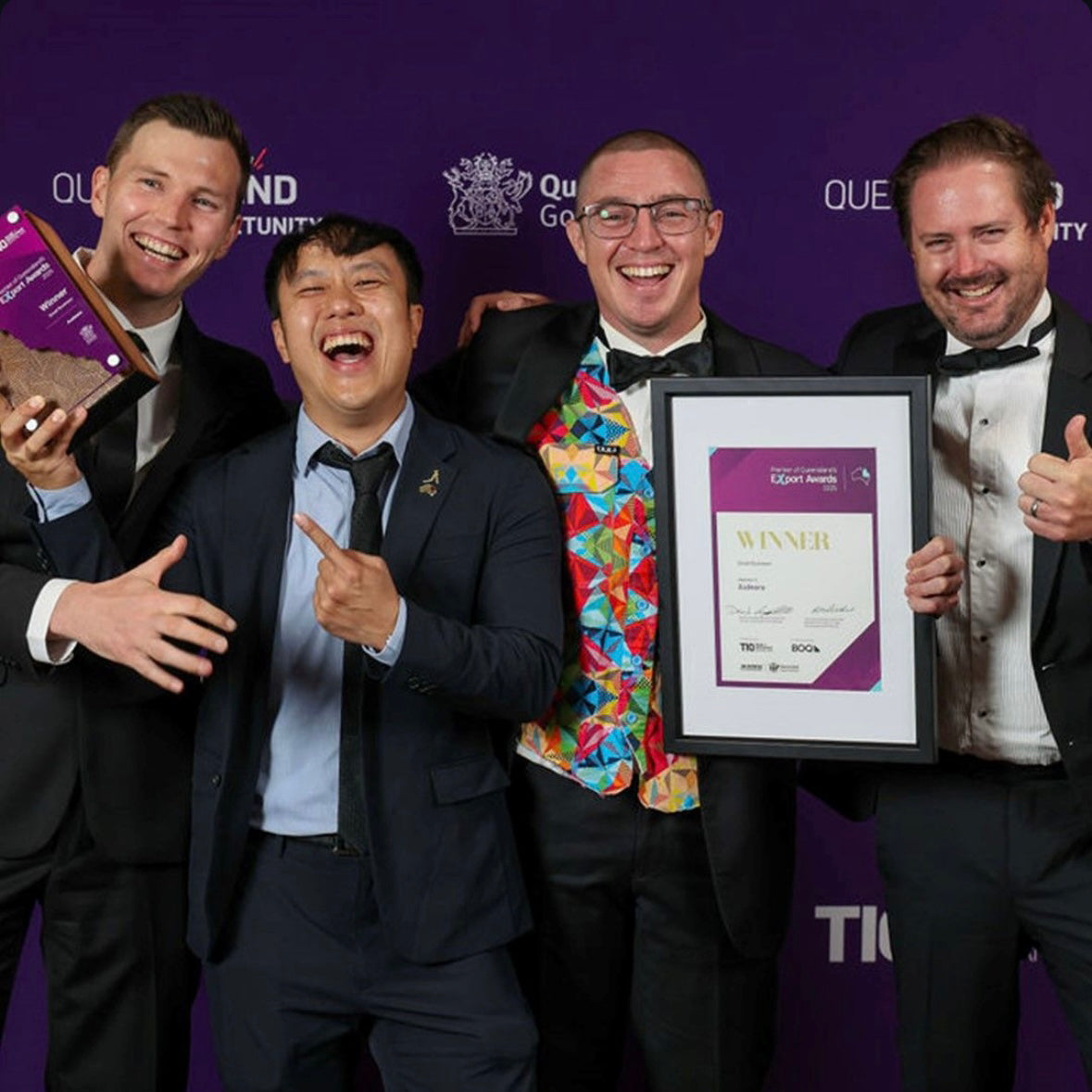 From left to right: Dylan Whitehouse, Bill Peng, James Fielding, John Krajewski – holding awards and celebrating together