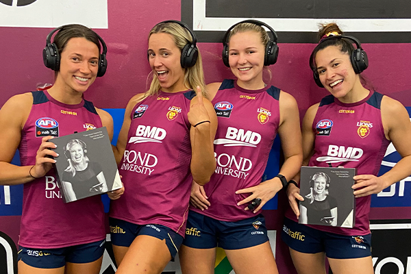Brisbane Lions AFLW players wearing their Audeara headphones
